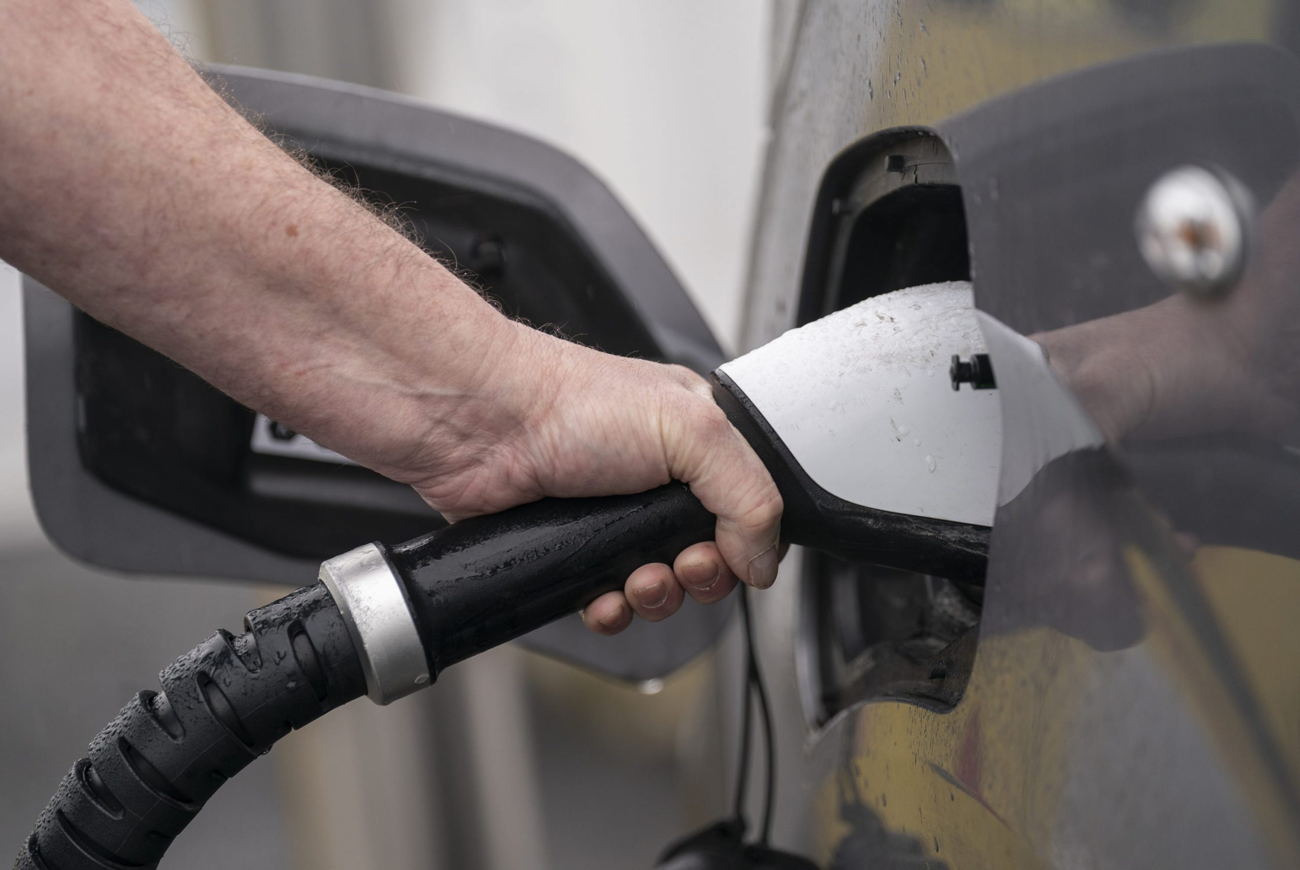 An-electric-car-being-charged-Danny-LawsonPA-scaled.jpg